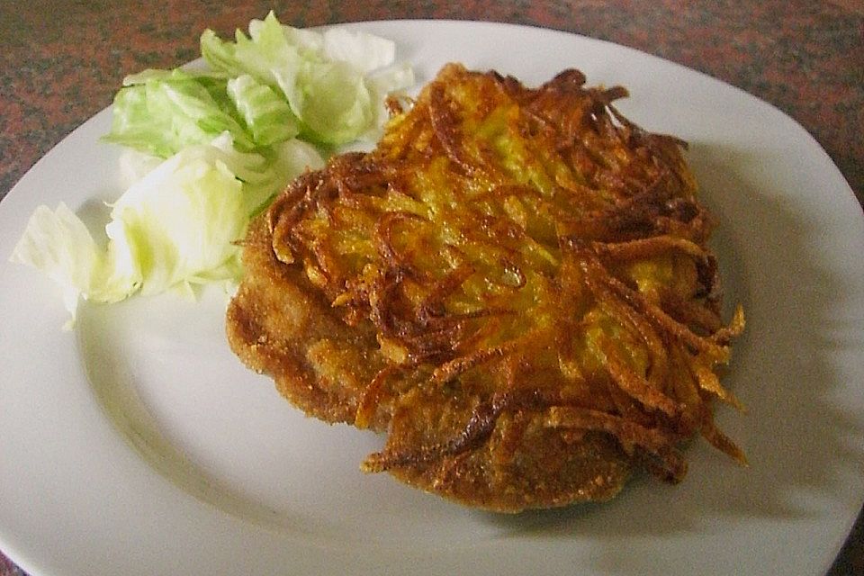 Paniertes Schweineschnitzel mit Kartoffelkruste